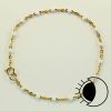 14K gold filled flat cable satellite chain bracelet with white enamel bead.